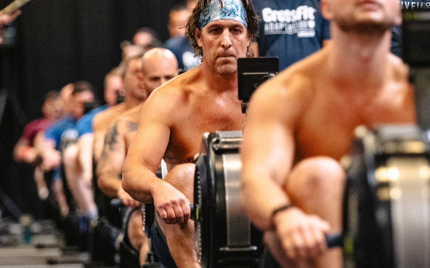 Adaptive athletes competing on rowing machines at the 2025 Adaptive CrossFit Games